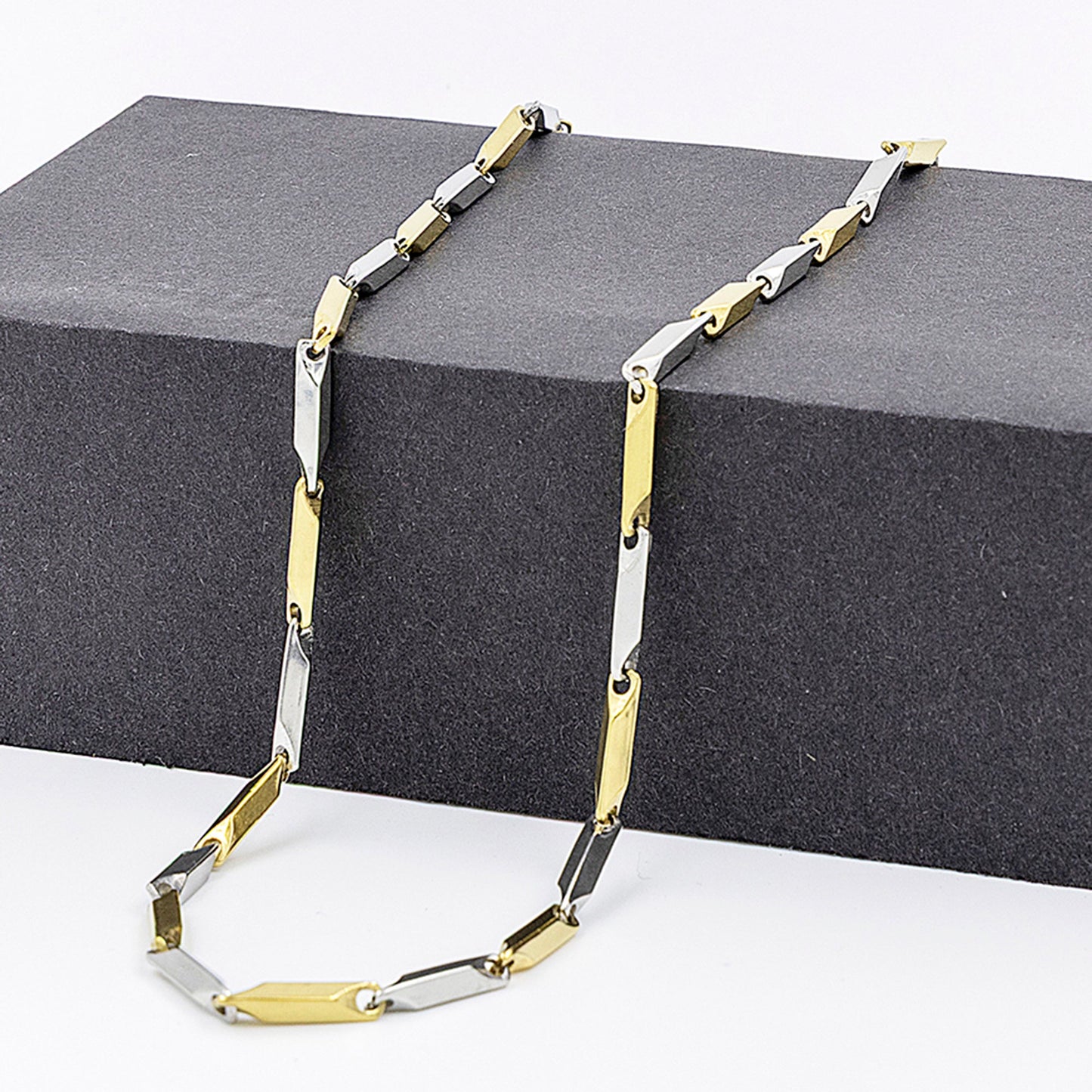 Emberstone Jewellery men's stainless steel necklace featuring a modern rice chain design in silver and gold tones
